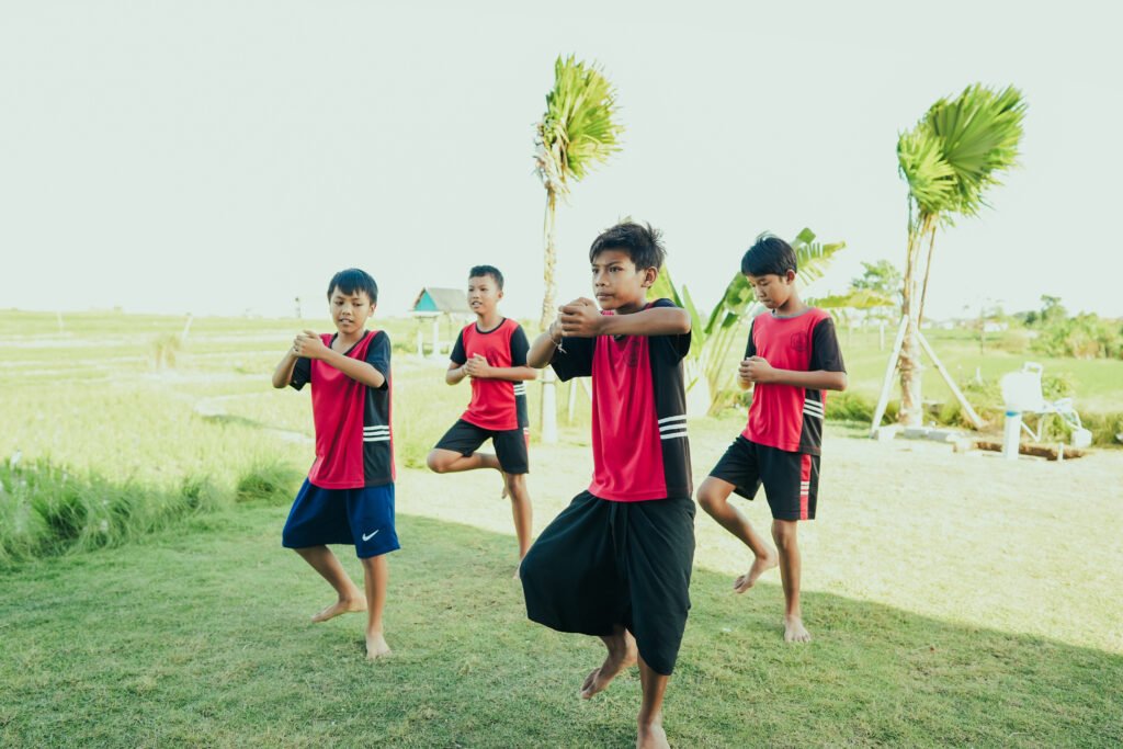 local children from Cepaka Village learning traditional Balinese Baris dance with COCO Social Fund.